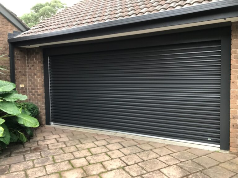 roller garage door with 2 metal posts, and overhead fascia in monument for our customer in Dingley