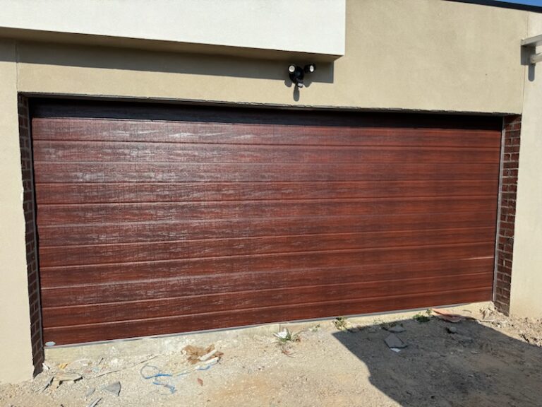 sectional garage door in woodgrain caoba colour for customer in Dandenong